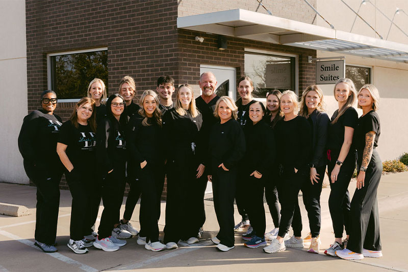 Doctor and his team smiling