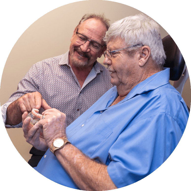 dr leedy discussing dental procedure with patient