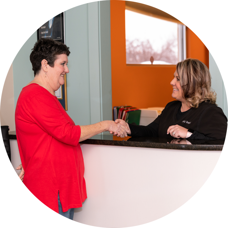 office manager welcoming dental patient