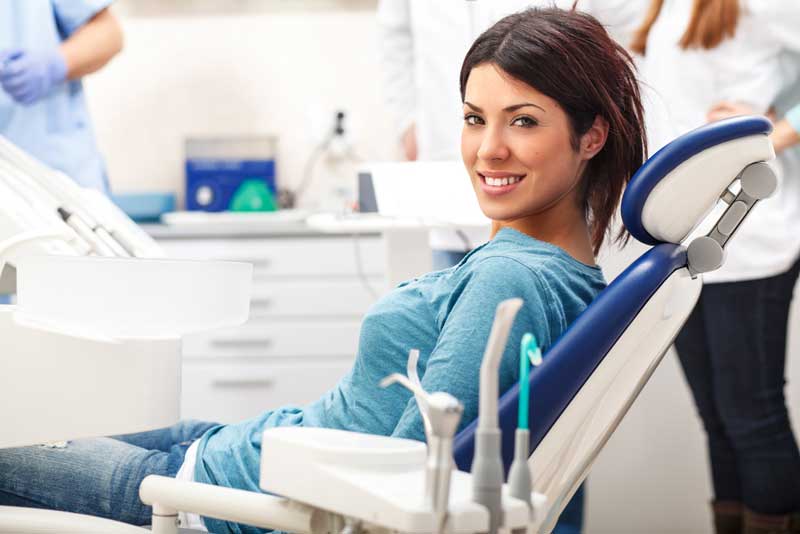 a patient smiling after her dental sedation