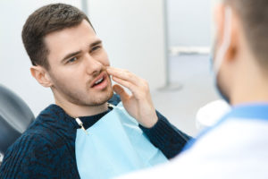 Dental Patient Suffering From Mouth Pain On A Dental Chair, In Abilene, TX