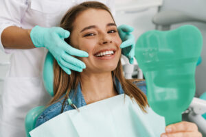 Modern dental practice with prosthodontist consulting a patient